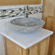 Closeup Side View of White Topped Vanity Unit & Grey Marble Bathroom Basin