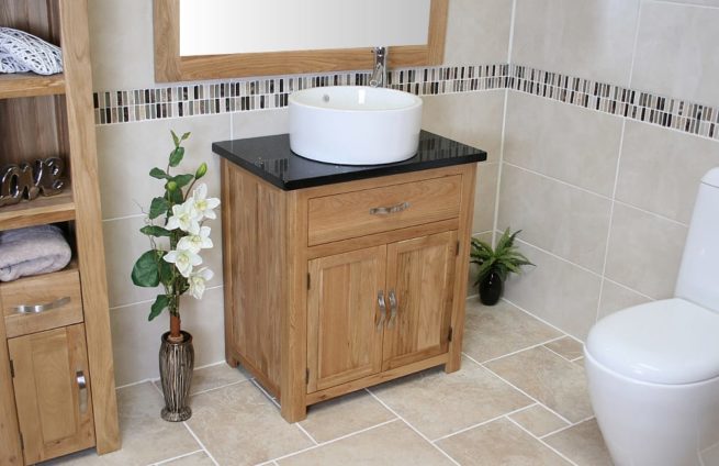 Side View of Round White Ceramic Basin on Black Quartz Topped Oak Vanity Unit