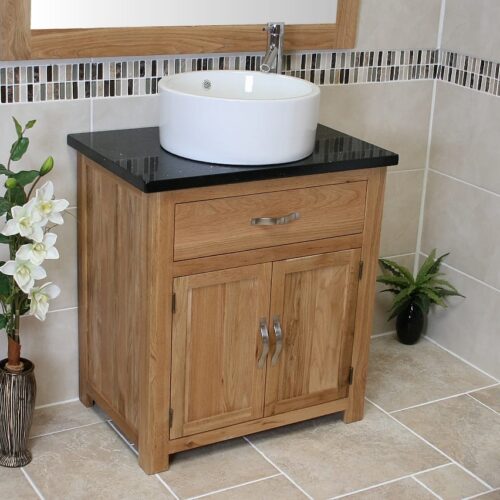 Close-up Side View of Round White Ceramic Basin on Black Quartz Topped Oak Vanity Unit
