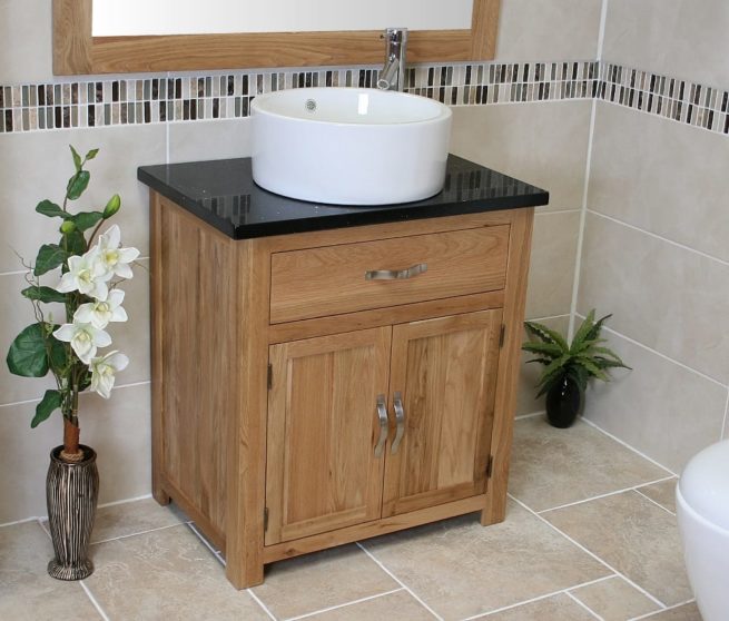 Close-up Side View of Round White Ceramic Basin on Black Quartz Topped Oak Vanity Unit