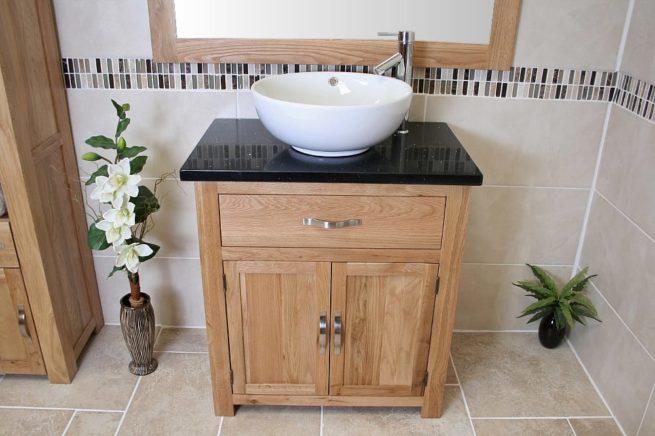 Front View of Round Curved White Ceramic Basin on Black Quartz Topped Oak Vanity Unit