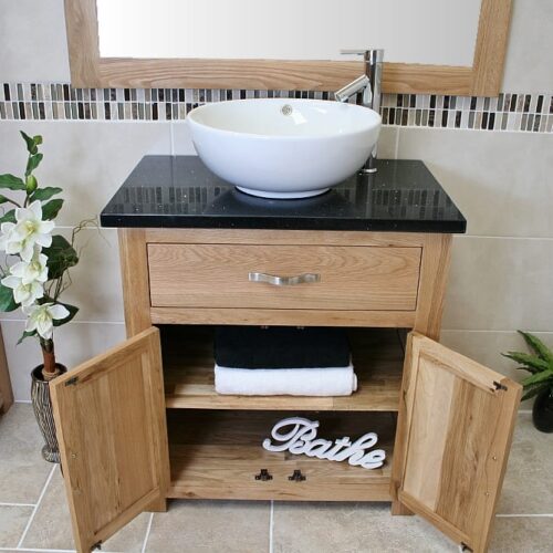 Front View of Round Curved White Ceramic Basin on Black Quartz Topped Oak Vanity Unit Showing Cupboard Storage