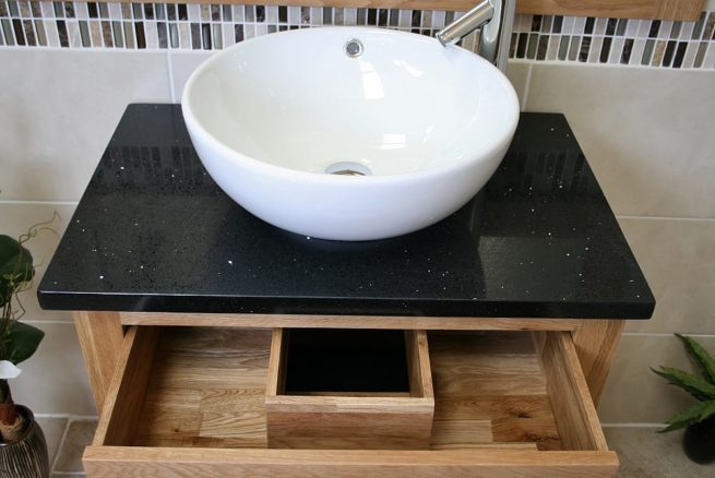 Above View of Round Curved White Ceramic Basin on Black Quartz Top Oak Vanity Unit Showing Drawer Storage