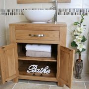 Oval White Ceramic Basin on Vanity Unit with Open Doors