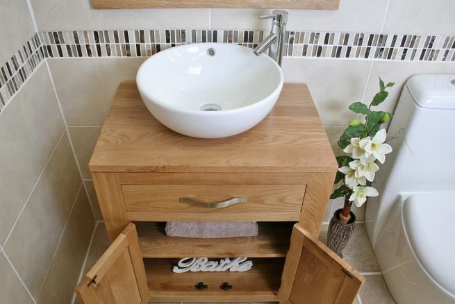Above Close View of Round Curved White Ceramic Basin on Oak Vanity Unit with Open Doors