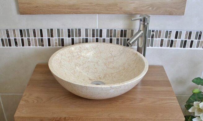 Close-Up of Cream Marble Basin on Oak Top