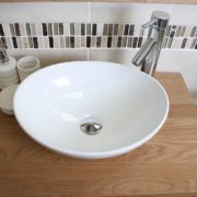 Above View of Oval White Ceramic Basin on Single Oak Top Vanity Unit