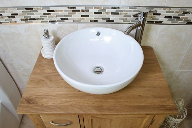 Above View of White Ceramic Round Curved Bathroom Basin on Oak Top Vanity Unit