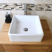 Above Close-Up of Square White Ceramic Basin on Oak Top