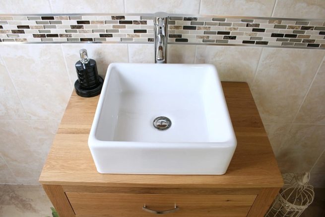 Above Close-Up of Square White Ceramic Basin on Oak Top