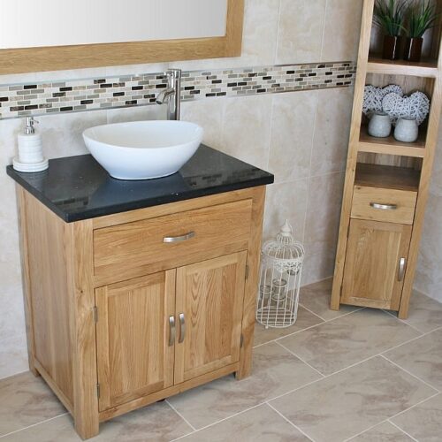 Far Side View of Oval White Ceramic Basin on Black Quartz Topped Oak Vanity Unit