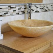 Close-Up of Oval Onyx Basin on Oak Top