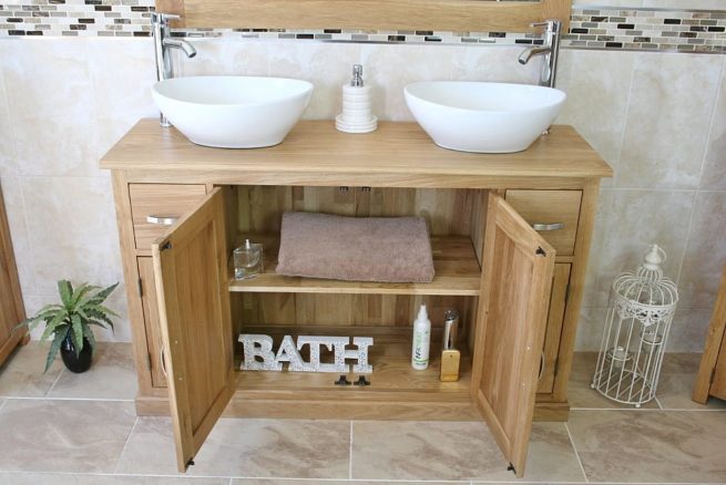 Oval Ceramic White Basins on Oak Topped Vanity Showing Storage Space