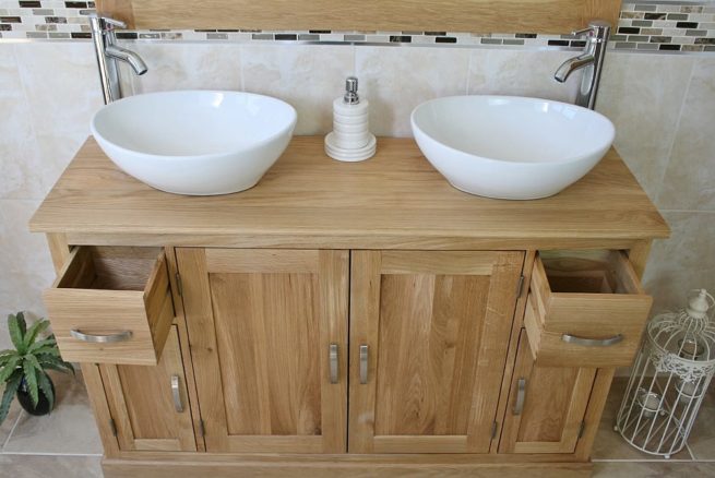 White Oval Ceramic Basins on Oak Topped Bathroom Vanity Unit Showing Opened Drawers