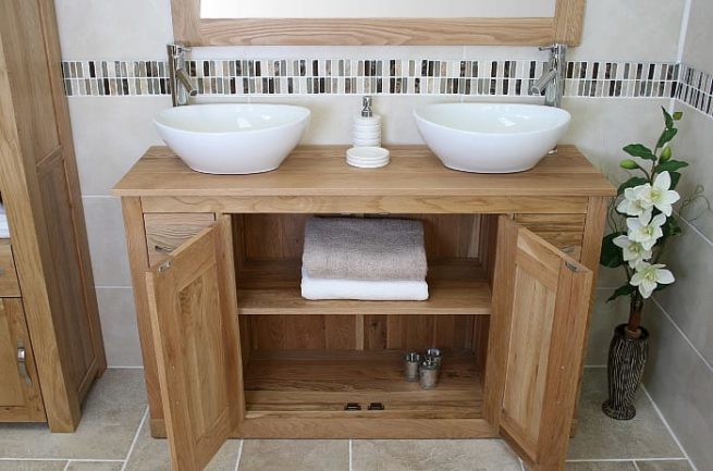 Double White Oval Ceramic Basins on Oak Top Vanity Unit with Open Doors