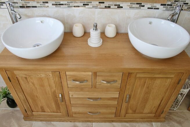 Close-UpView of Two White Ceramic Round Basins on Large Oak Vanity Unit