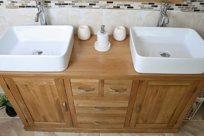 Close-Up View of Two White Ceramic Rectangle Basins on Large Oak Vanity Unit