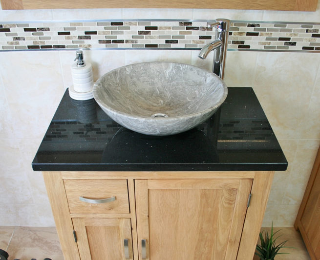 Above View of Oval Grey Marble Basin on Black Quartz Top Vanity Unit