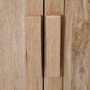 Oak wooden handles on vanity unit doors