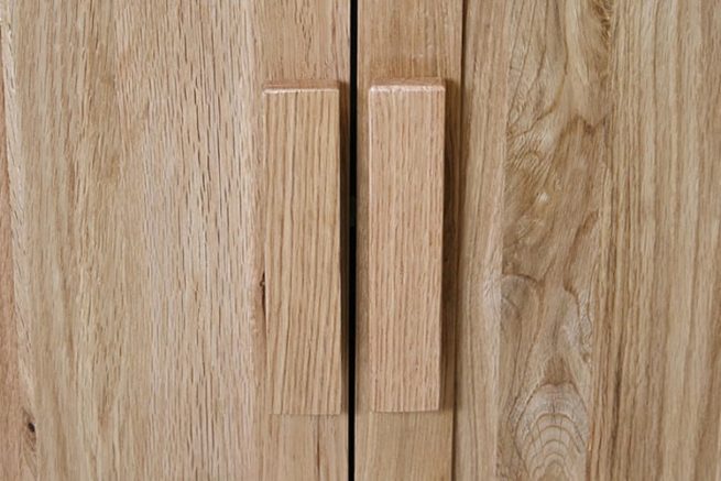 Oak wooden handles on vanity unit doors
