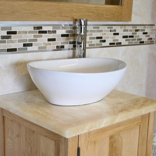Closeup Side View of Oval White Ceramic Basin on Onyx Top Vanity Unit