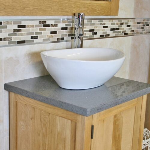 Close-up View of Oval White Ceramic Basin on Grey Quartz Topped Vanity