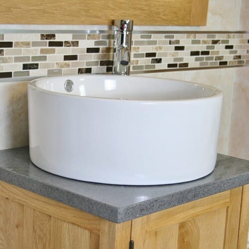 Close-up View of Round White Ceramic Basin on Grey Quartz Topped Vanity Unit