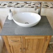 Above View of White Ceramic Oval Basin on Grey Quartz Top Vanity Unit