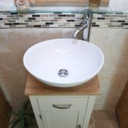 Above View of White Ceramic Basin on Oak Top of Painted Single Vanity Unit