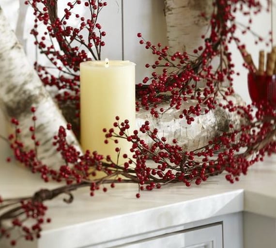 White Candle Cradled by Branch of Red Berries