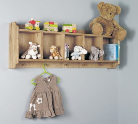 An Oak Shelf Stacked with Children's Toys